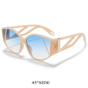 Macro detail of marble pattern frame and hollow geometric temple on oversized sunglasses