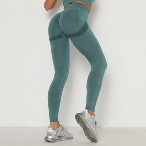 Detail showing seamless high-waist yoga leggings with booty lifting texture in teal green