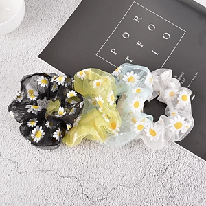 Daisy embroidered mesh hair scrunchies in black, yellow, green, and white colors