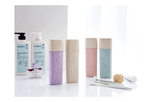 Detailed view of portable travel toothbrush holders with elegant embossed floral patterns