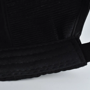 Detailed macro view of the breathable mesh lining and stitching on the black baseball cap