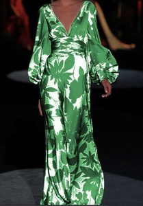 Detail of green floral maxi dress with deep V-neck and dramatic lantern sleeves on the runway