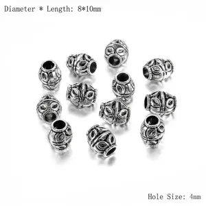 Détail de perles d'espacement en alliage argenté avec motif d'oeil et trou de 4 mm
