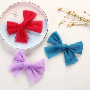 Three-piece set of mesh bow hair clips for girls in red, blue, and purple colors