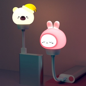 USB night lights featuring cute white bear and pink rabbit designs on a power bank