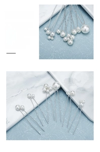 Detailed close-up of handmade pearl hair pins featuring wire-wrapped white pearls on U-shape pins