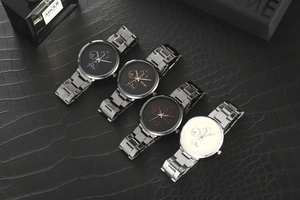 Multiple YOLAKO men watches with stainless steel bands on black textured background