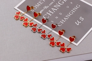 Three pairs of heart clover tassel earrings in gold, silver and rose gold metal finishes