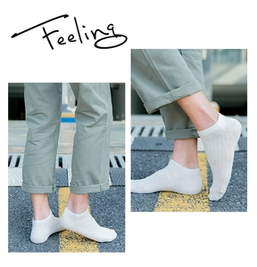 Detail view of white cotton low cut ankle socks with ribbed texture for men's daily wear