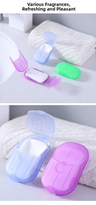 Close-up of portable travel soap sheets in colorful mini plastic storage containers