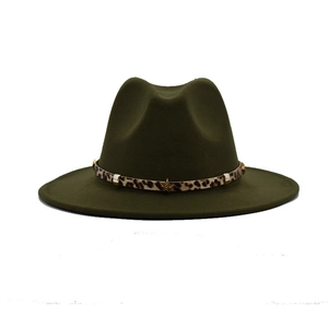 Detail of olive green fedora hat featuring leopard print band and gold star rivets