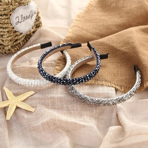 Three-piece set of thin headbands with crystals, navy beads, and grey rhinestones detail