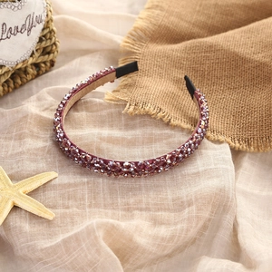 Elegant beaded crystal headband in deep purple with soft velvet lining for women