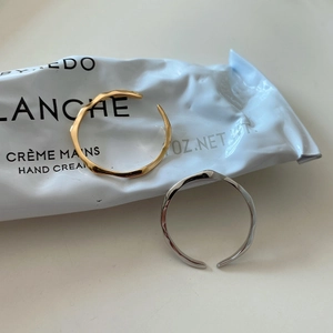 Minimalist irregular wave-shaped open ring in gold and silver finish for women