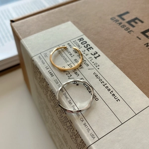 Detail of irregular wave texture on gold and silver minimalist 925 sterling silver rings