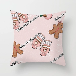 Pink Christmas pillow cover with gingerbread man and Baby It's Cold Outside pattern