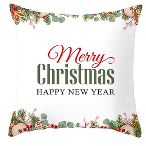 White Christmas pillow cover with Merry Christmas text and festive wreath pattern