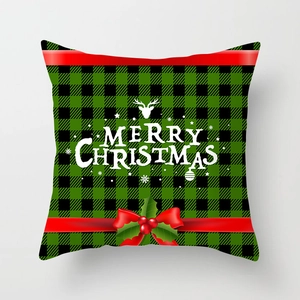 Detailed view of Christmas pillowcase with plaid pattern, deer head and bow decoration