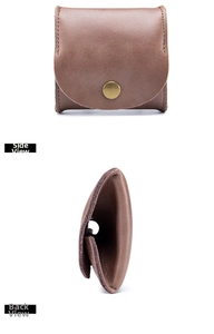 Macro side and front view of brown genuine leather coin purse with brass snap fastener