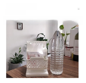 Three-layer hollow desktop organizer shown next to a water bottle for size comparison