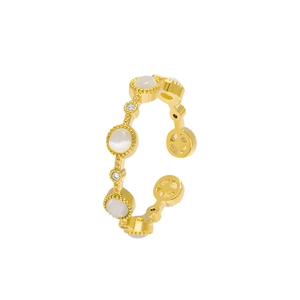 Elegant gold open ring featuring a white cat eye stone and cubic zirconia accents
