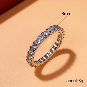 Eternity ring with 3mm band width and round-cut zircons in a minimalist luxury style