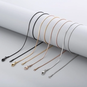 Polished stainless steel snake chain necklaces in black, gold, and silver finishes