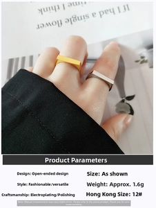 Detail showing gold and silver rectangle open rings with polished finish on model hand