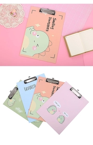 Detail of A4 clipboards with cute dinosaur patterns in pink, blue, green, and orange colors