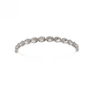 Detail of silver alloy headband with eleven sparkling oval-shaped rhinestones for brides