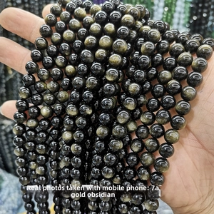 Close-up of 7A natural golden obsidian beads showing brilliant golden sheen and luster