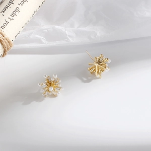 Elegant gold fireworks stud earrings with white pearls and sparkling cubic zirconia crystals