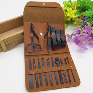 Detailed 16-piece black stainless steel manicure set in a brown leather folding case