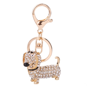 Sparkling crystal dachshund dog keychain with golden metal finish for stylish accessory bag