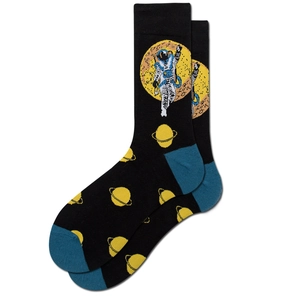 Detailed close-up of crew socks featuring astronaut and planet motifs with teal accents