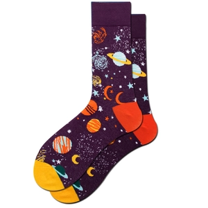 Detail of crew socks with purple galaxy patterns showing stars and colorful planets