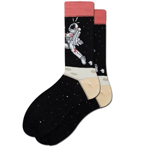 Detail of crew socks with astronaut moonwalking graphic and starry space knit pattern