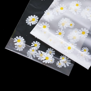 Frosted and clear daisy pattern plastic drawstring bags for gifts and accessories