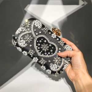 Elegant black evening clutch bag with handmade sequins, pearls and rhinestones floral pattern