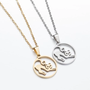 Close-up of gold and silver geometric hollow cat pendants with O-chains for women