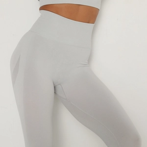 Close-up of seamless light grey high waist yoga pants showing compression waistband texture