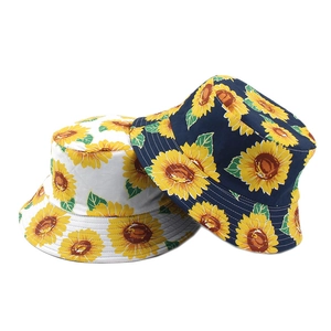 Reversible sunflower print bucket hats in white and navy blue for summer sun protection