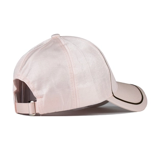 Detail of pink satin baseball cap featuring adjustable back strap and silver metal buckle