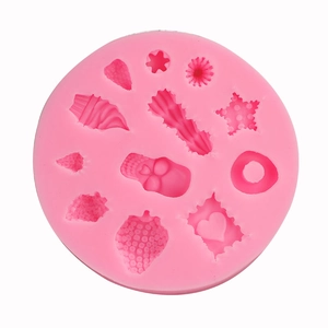Pink silicone waffle and dessert mold with various geometric star and heart shapes
