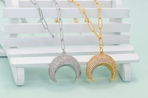 Minimalist crescent moon horn pendant necklace in gold and silver with zircon pave
