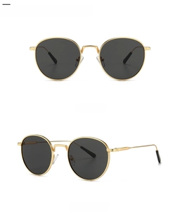 Front and side view of retro round metal sunglasses with gold frames and dark lenses