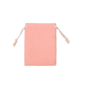 Close-up of pink cotton drawstring pouch showing fabric texture and secure closure