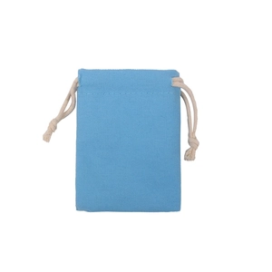 Detail view of sky blue cotton drawstring pouch with woven texture and cream-white rope