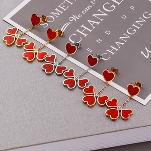 Elegant heart and clover drop earrings in gold, silver, and rose gold finishes
