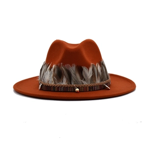 Ethnic wide brim fedora hat in rust red wool felt with feather and beaded band decoration